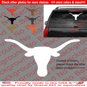 May include: White vinyl decal of a Texas Longhorn steer head with horns. The decal is shown on the back window of a black SUV. The image also shows several other color variations of the decal.