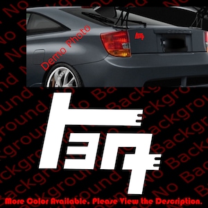 May include: White vinyl decal of the Toyota logo, featuring the stylized letters "T", "O", "Y", "O", "T", "A".