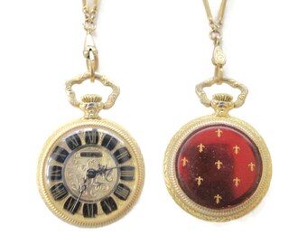 Zegarek Bucherer 25 mm z motywem lilii/czerwona emalia/pozłacany/17 kamieni, nakręcany mechanicznie/łańcuch o długości 28 cali/