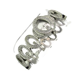 May include: Silver wristwatch with a white face and a band made of interlocking G's encrusted with rhinestones.