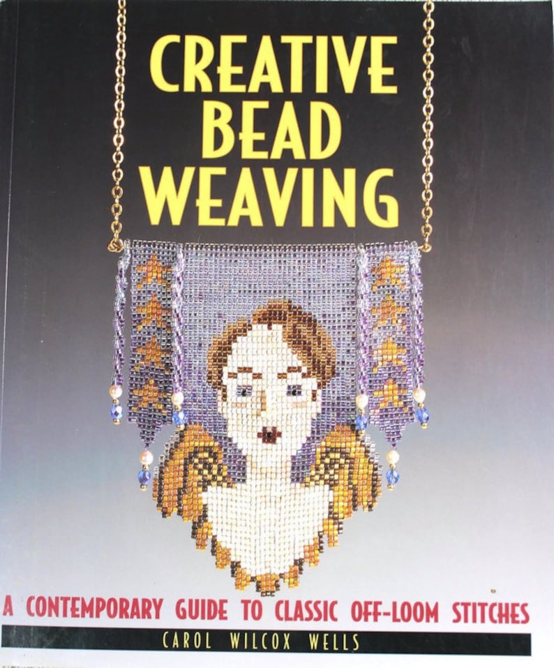 May include: A book cover with the title "CREATIVE BEAD WEAVING" in yellow letters. The cover features a beaded pendant with a woman's face and angel wings. The pendant is suspended from a gold chain. The book's subtitle is "A CONTEMPORARY GUIDE TO CLASSIC OFF-LOOM STITCHES".