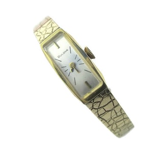 Bulova Ladies Watch/ 10K R.G.P N3 Bezel / Gold tone Bracelet /Stainless  Steel Back/  1973  Oblong Crystal  / 17 Jewels Swiss / Model V50350