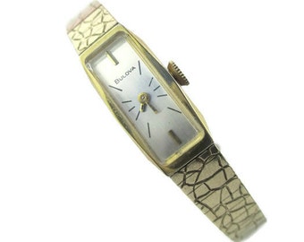 Bulova Ladies Watch/ 10K R.G.P N3 Bezel / Gold tone Bracelet /Stainless  Steel Back/  1973  Oblong Crystal  / 17 Jewels Swiss / Model V50350