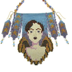 May include: A beaded necklace and earring set featuring a portrait design. The necklace has a light blue background with a pixelated face and wings. The earrings and necklace have gold, blue, and purple beads with dangling accents.