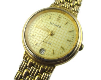 Technos Luxor Watch/ Time Date Quartz/ 18k Gold