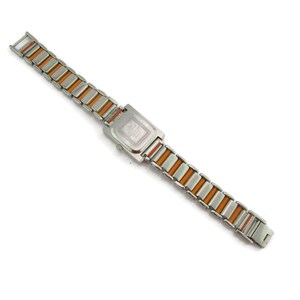 May include: A silver and orange watch with a square face and a metal band.