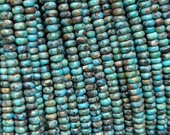 May include: A collection of small, round, disc-shaped turquoise beads arranged in vertical strands. Each bead features a vibrant blue-green color with natural dark brown and black matrix inclusions, creating a textured, variegated appearance.
