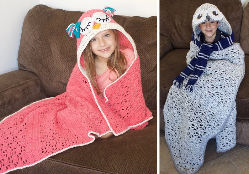 May include: Two children wearing crocheted owl hooded blankets. The girl's blanket is pink with a white trim and the boy's blanket is gray with a blue and white striped scarf.