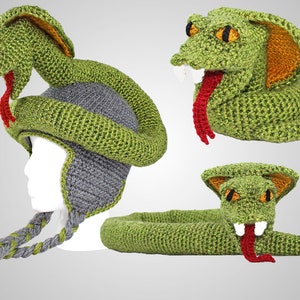 May include: Green crocheted snake hat with a grey ear flap and a matching snake tail. The hat is shaped like a snake with a red tongue and yellow eyes.