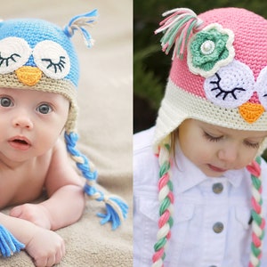 May include: Two children wearing handmade crochet owl hats. The blue hat has blue and tan braids, while the pink hat has pink, green, and white braids. Both hats feature owl eyes, an orange beak, and ear tufts.
