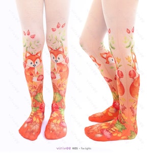 May include: White tights featuring a printed design of orange foxes, red mushrooms, green leaves, and autumn foliage. The pattern extends from the toes up to the thighs, showcasing a vibrant woodland theme with detailed illustrations of forest elements.
