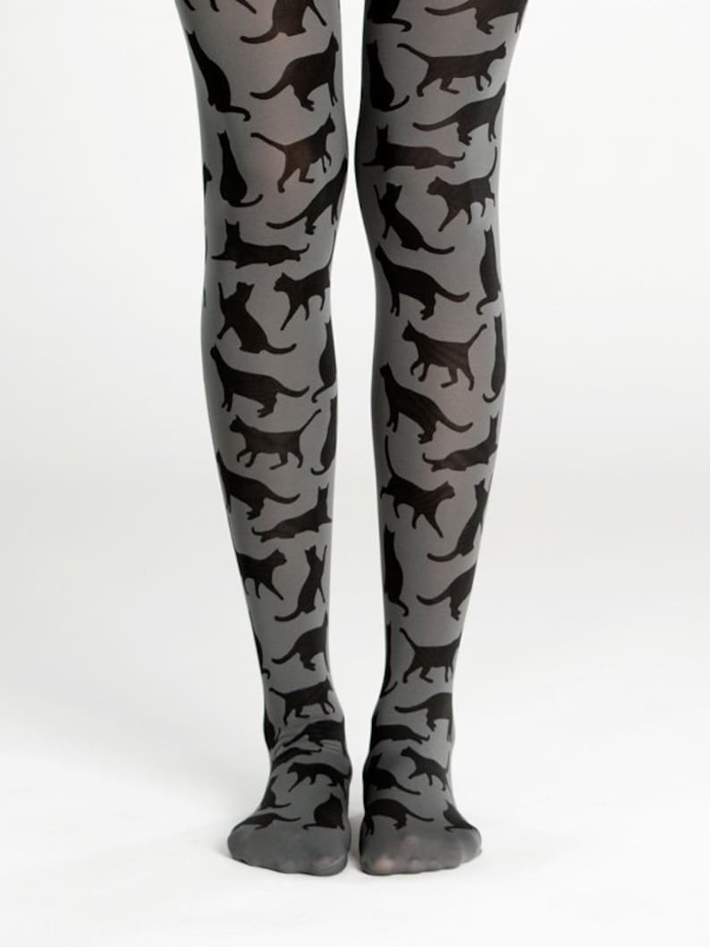 May include: Gray tights with a black cat silhouette pattern.
