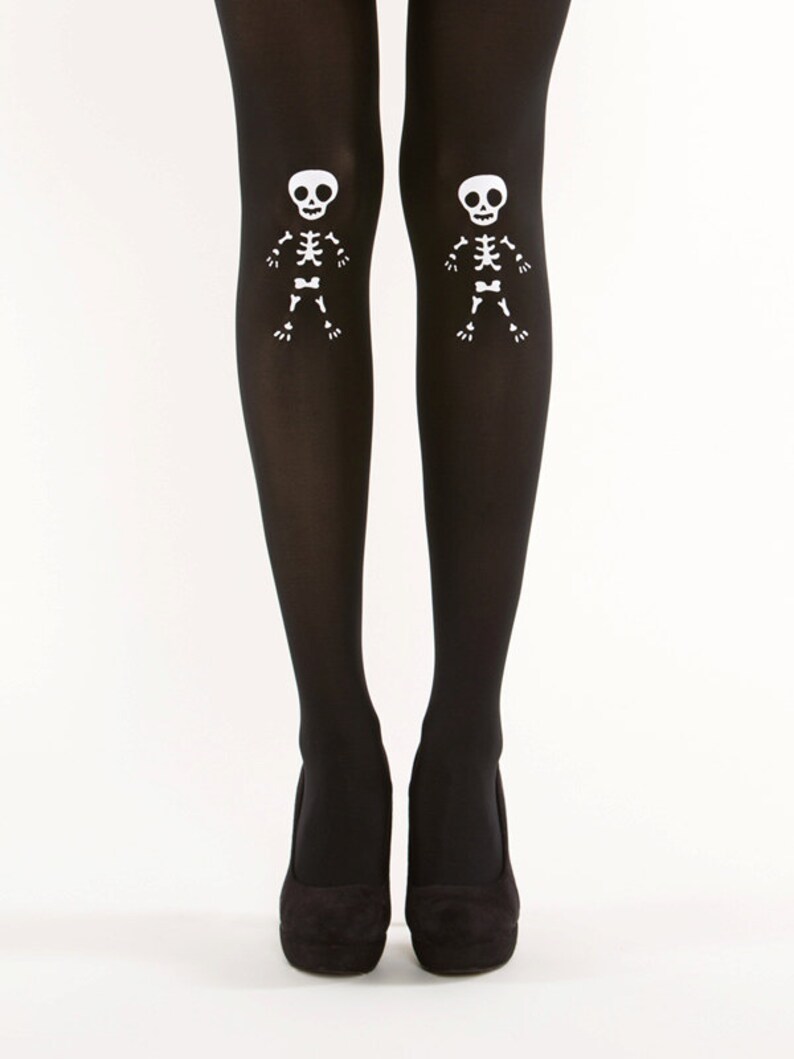 May include: Black tights with white skeleton designs on the thighs.
