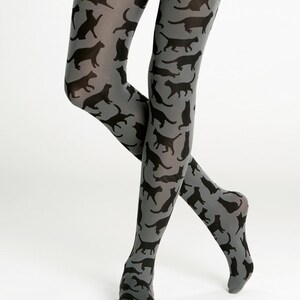 May include: Gray tights with a black cat print pattern.