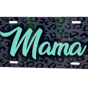 May include: A black and white leopard print license plate with the word "Mama" in teal blue lettering.
