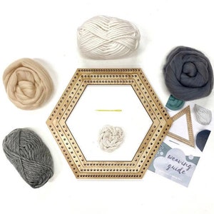 May include: A wooden hexagonal weaving loom with yarn in beige, gray, and white. The loom has a small needle and a weaving guide included.