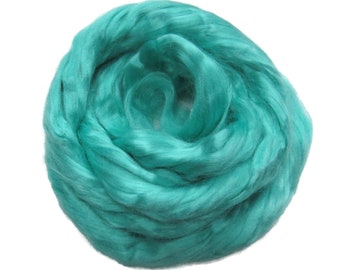 May include: A close-up of a teal blue fiber, resembling a fluffy cloud. The fiber is soft and textured, perfect for crafting.