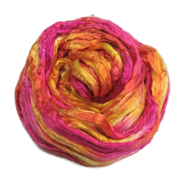 Mulberry Silk varigated roving, hand dyed in tones of magenta yellow.  Color: Sorbet
