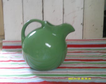 Beautiful Green Cannon Ball Pitcher, marked Hall pottery.