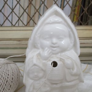 Most Unusual White Porcelain String Holder, Child with Cape and Hood