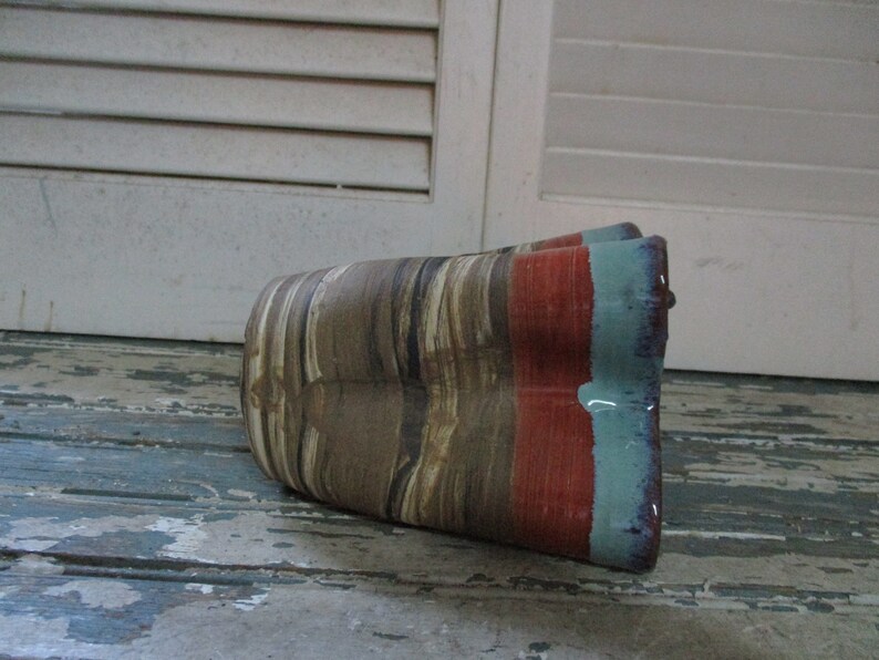 Scott Carlson of New Mexico has high gloss glaze in shades of rust and turquoise with signature on the bottom It measures 5x4 12