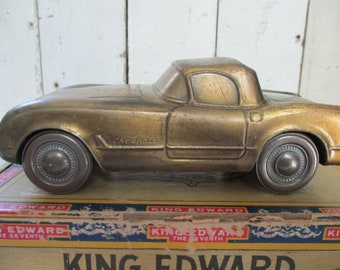 1974 Cast metal 1953 Corvette bank w/ plug.  Bank marked: "CORVETTEE" and 1974 Banthrico Chicago on the underside. Working metal wheels.