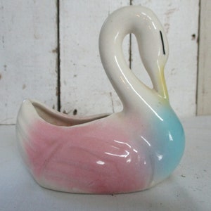 What a Graceful Swan, Pink, Blue and soft Yellow. Mid-Century Shawnee Pottery USA  Measures 5&quot; long, 5 1/2&quot; tall and 2 1/4&quot; wide.