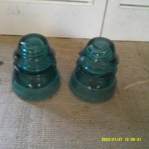 2 Hemingray 42 Aqua (Blue/Green) glass insulator from an old powerline. Manufactured between 1921 and 1960.