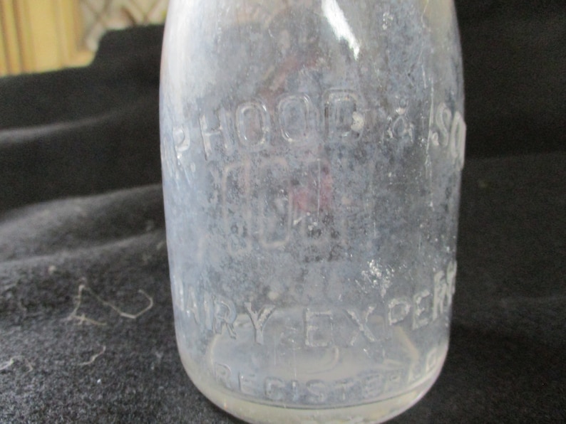 Embossed H.P. Hood & Sons, Dairy Experts. Uncommon half pint Maine 48 seal pint milk bottle. On the bottom is has Hood 1935. image 3