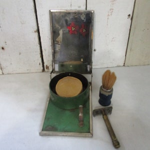 Vintage Travel Shaving Kit, Mirror, Shaving Brush, Mustache Razor, Shaving Soap all together in a Metal Container. Folds out.
