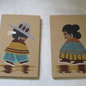 Sand Painting of Mexican Man with Big Sombrano and Woman with colorful shawl. Pretty Black, Browns, Turquoise, Gray and White Sand Designs