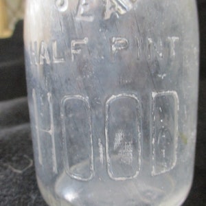 Embossed H.P. Hood & Sons, Dairy Experts. Uncommon half pint Maine 48 seal pint milk bottle. On the bottom is has Hood 1935. image 2