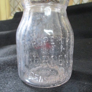 Borden&#39;s Condensed Milk Company, Half Pint Milk Bottle, Borden&#39;s Trademark, Eagle with Outspread Wings. Ribbed Sides.