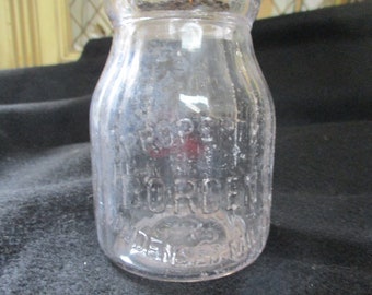Borden's Condensed Milk Company, Half Pint Milk Bottle, Borden's Trademark, Eagle with Outspread Wings. Ribbed Sides.