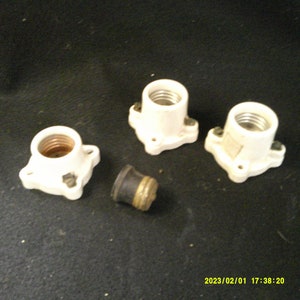 White Porcelian Light Sockets, 3 Light Sockets, Marked Levito 9062, Measures 1 3/4 inches tall and 2 inches square. 250V.