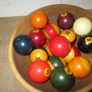 Vintage Q-Balls, 22 plus the Stricker ball, Vintage Billiard Balls. Colorful display.