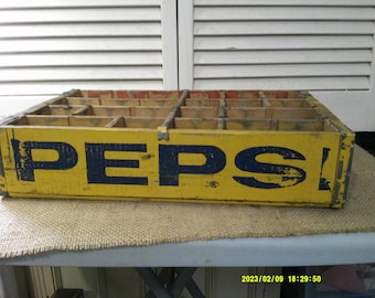 Cassa per bottiglie PEPSI da 24 bottiglie vintage giallo brillante con lettere blu.