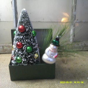 Tabletop Christmas Decoration, Green Metal Index Box with Flocked Bottle Brush Green with Ornaments, also Pine needles and Snowman