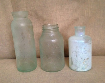 Turquoise Grouping of Vintage Bottles 1 is marked Horlick Malted Milk Racine Wis USA