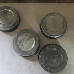 Set of 3 Hazel Atlas Zink Canning Jar Lids, and glass inserts. Inscribed on glass insert, &quot;Boyd&#39;s Cap For Mason Jar&quot;.