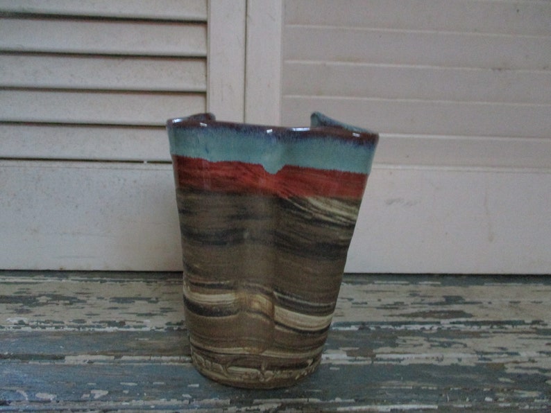 Scott Carlson of New Mexico has high gloss glaze in shades of rust and turquoise with signature on the bottom It measures 5x4 12
