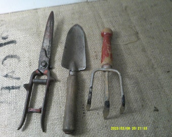 Vintage Garden Tools, Spade 11 1/2" wood handle, All Metal Clippers 12" marked Boker USA, and Claw Digger, 9" long with red wood handle.