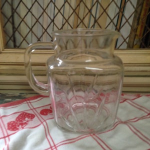 Clear glass, juice pitcher has Retro, Star Burst design Perfect for Lemonade