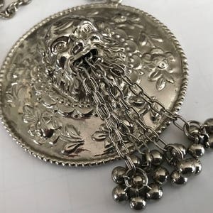 silver chanel charm