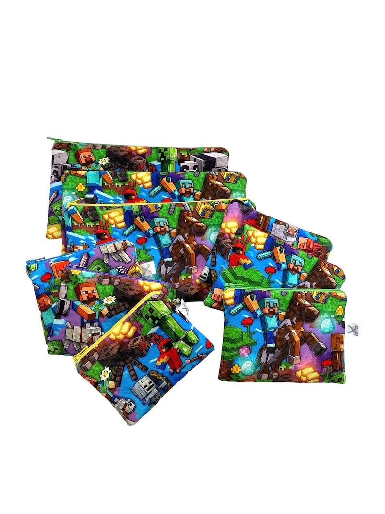 May include: A set of eight colorful zippered pouches with a Minecraft theme. The pouches feature a variety of characters and items from the popular video game, including Steve, Creeper, and a horse. The pouches are made of a soft, durable fabric and are perfect for storing small items like pencils, pens, and makeup.