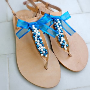 Sandalias con store conchas de mar