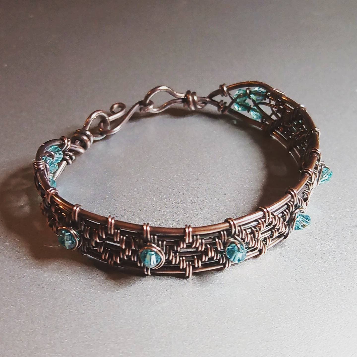Woven copper bracelet with blue bicone beads | Etsy