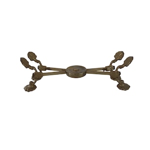 May include: A gold-toned metal serving tongs with ornate leaf-shaped handles. The tongs are crossed and the handles are extended outward.