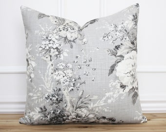 May include: A gray and white floral patterned pillow cover with a subtle linen texture.