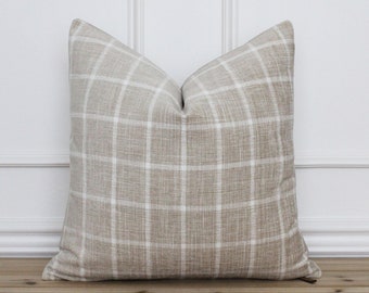 May include: A beige and white checkered throw pillow with a subtle textured fabric.